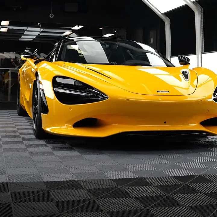 Yellow McLaren 750S in a detailing studio